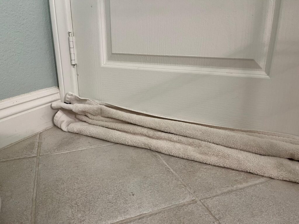 towel covering bottom door crack