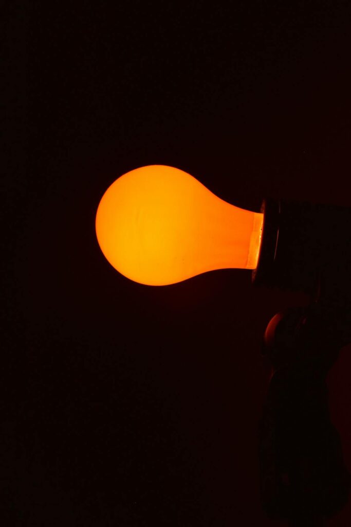 glowing orange light bulb